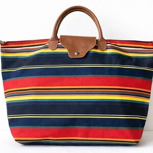 Large multicolored striped bag. Faux leather handles excellent condition